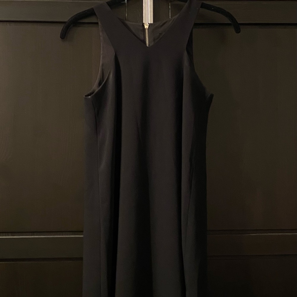 Elegant black Armani Exchange sized 0 with stunning neck design.